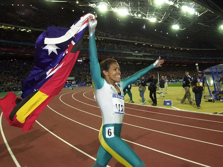 Cathey Freeman with Australian and Aboriginal Flag 